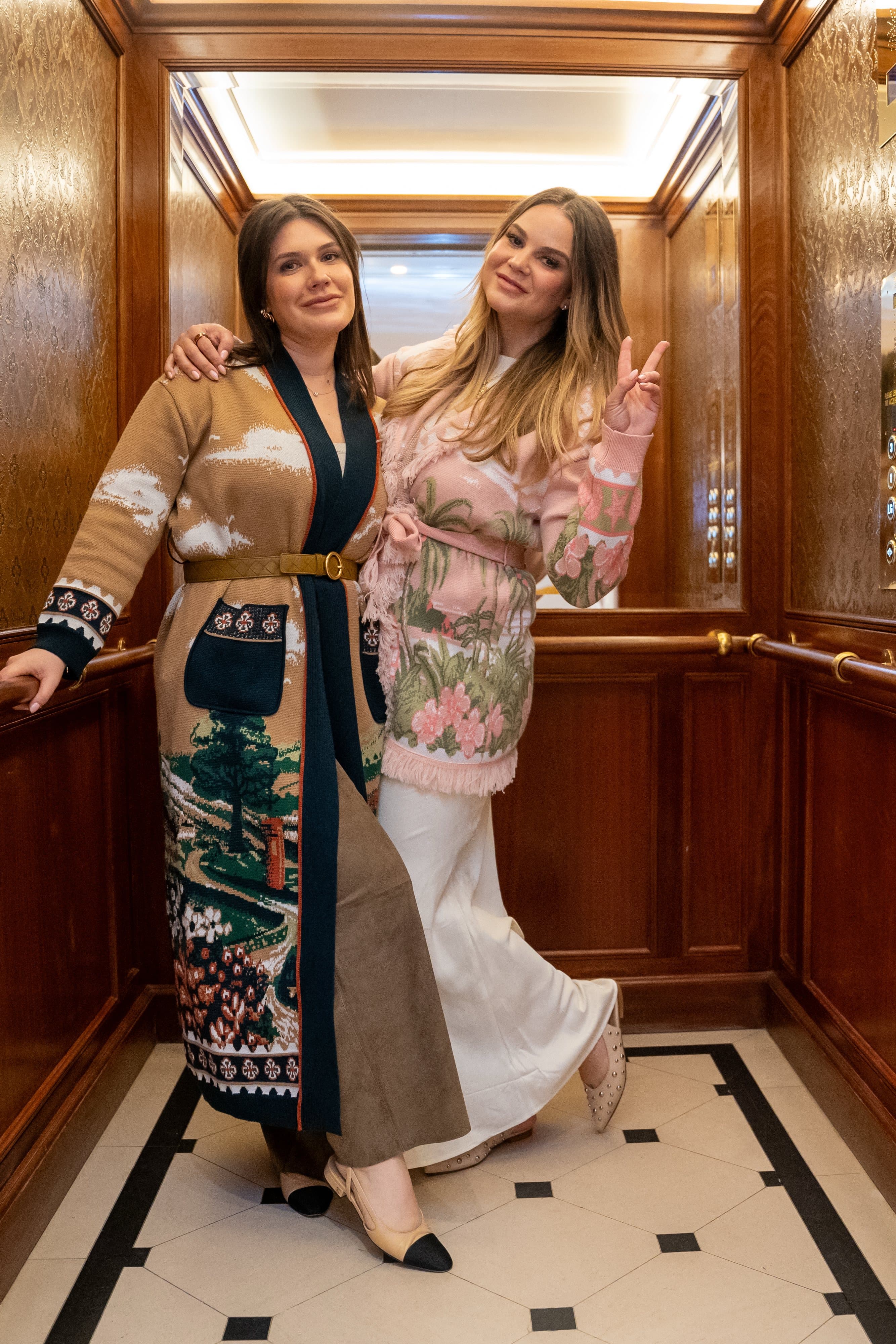 Aileen and Natalie together in a wood-panelled lift